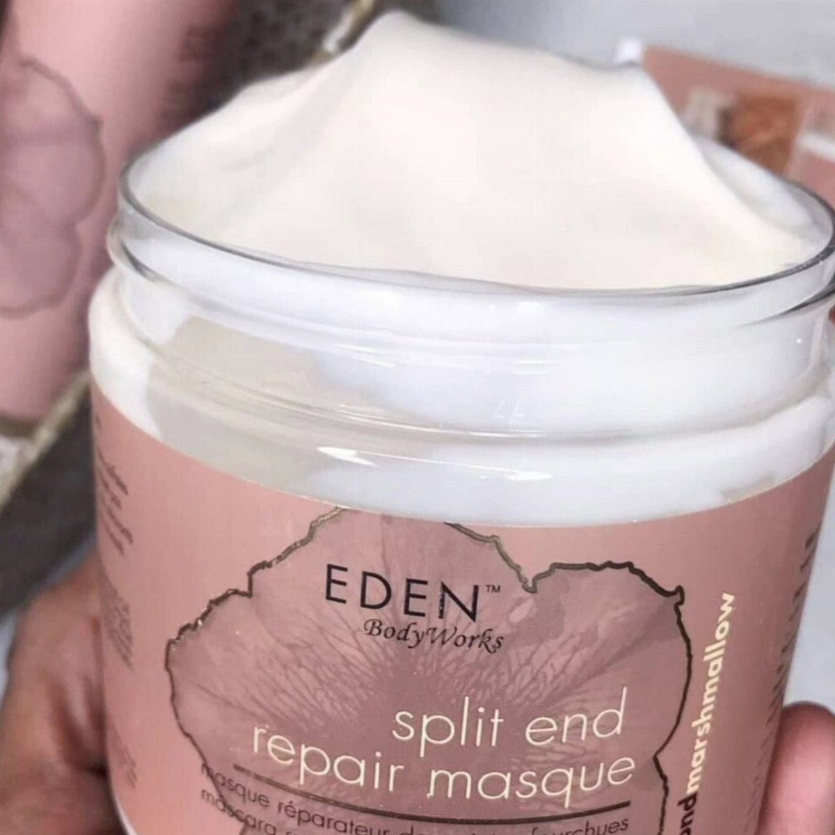 Eden BodyWorks split end repair masque jar filled with thick white hair cream.