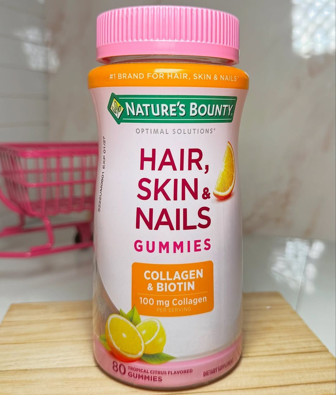 Nature's Bounty Hair, Skin and Nails gummies bottle with collagen and biotin labels.